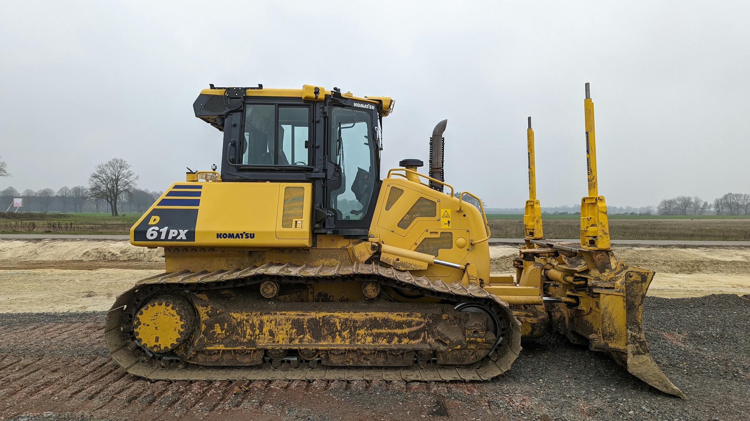 Yellow bulldozer at a construction site in Werlte, Germany. Heavy machinery in action.